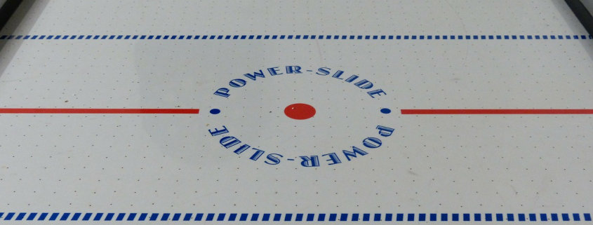 close-up photo of an air hockey table