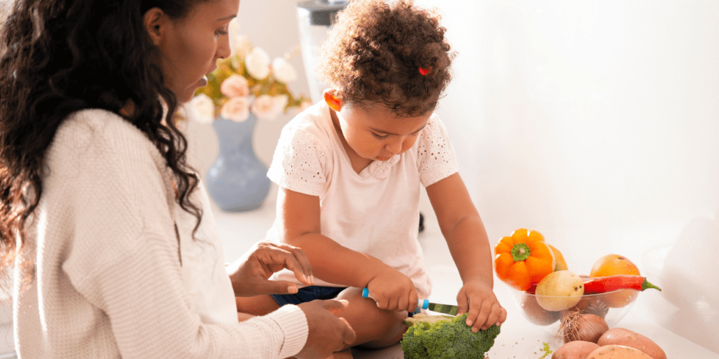 toddler and mom cooking
