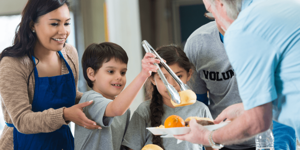 kids volunteering at soup kitchen
