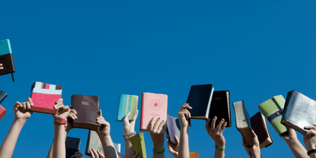 youth holding Bibles